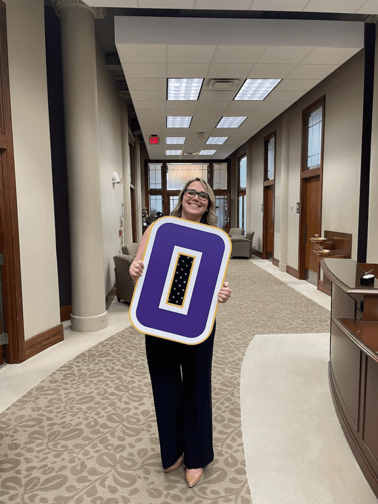 Erika Moeschke holding an "O"