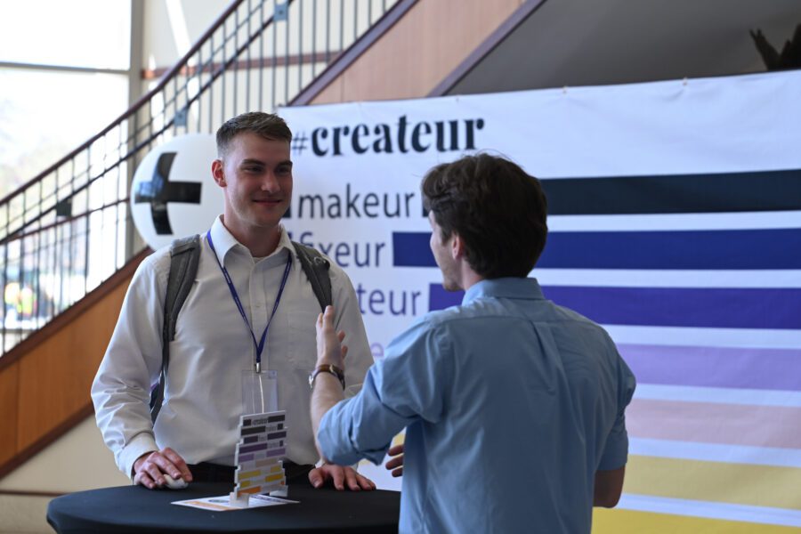 Haydin Rankin talks with student at createur conference