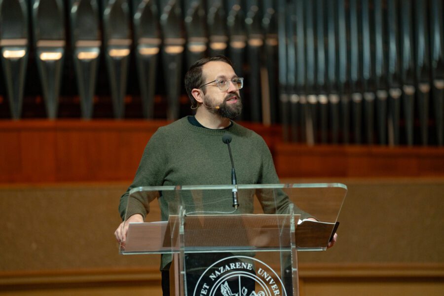 AJ Swoboda speaking in Centennial Chapel at podium