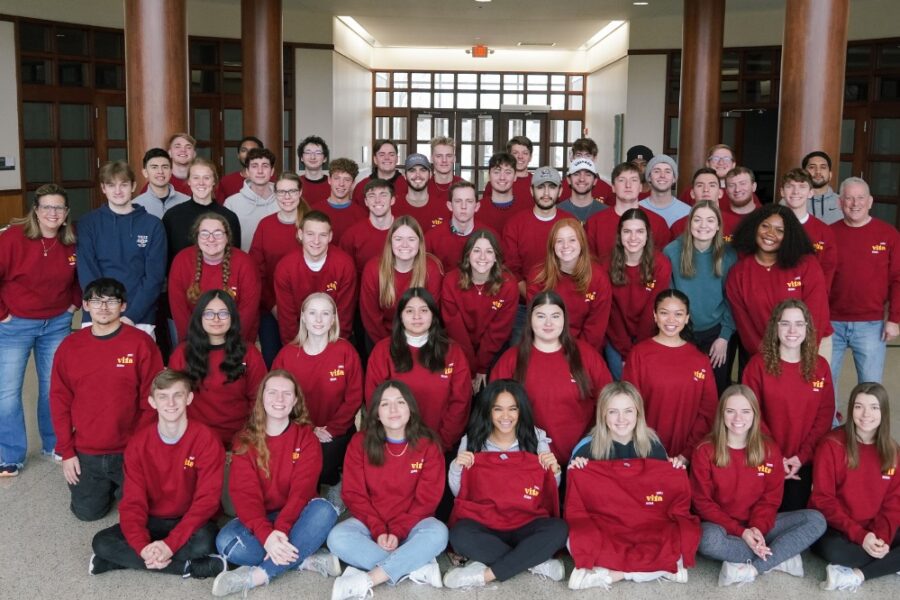 large group of students in red sweaters