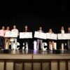 students with large checks winners Createur Pitch competition