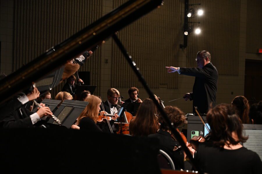 university orchestra with male conductor