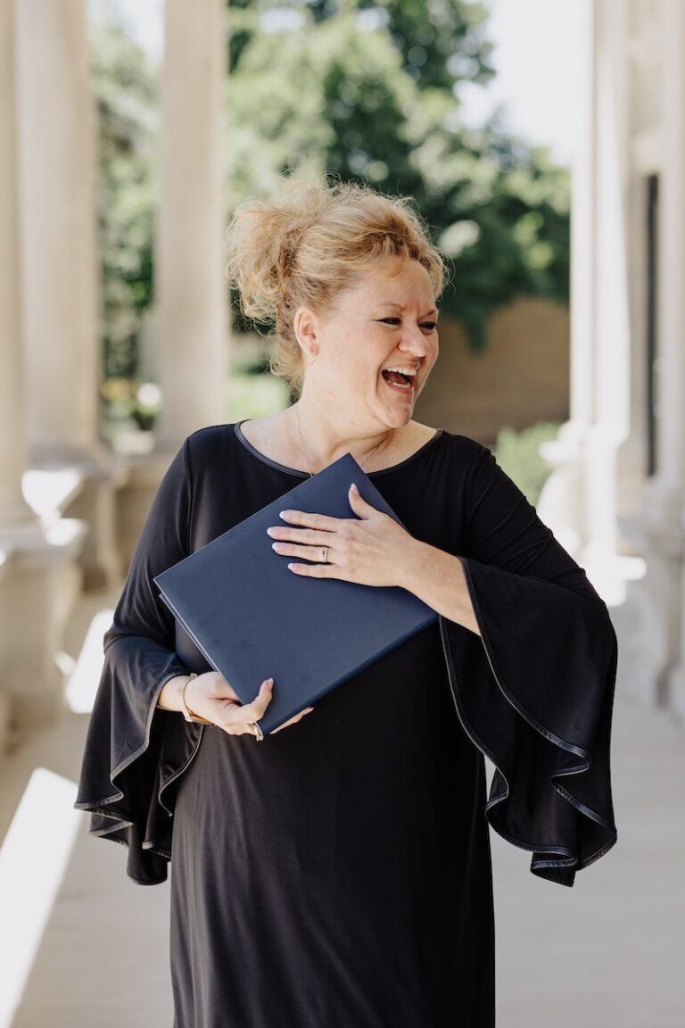 Amber Residori holding award