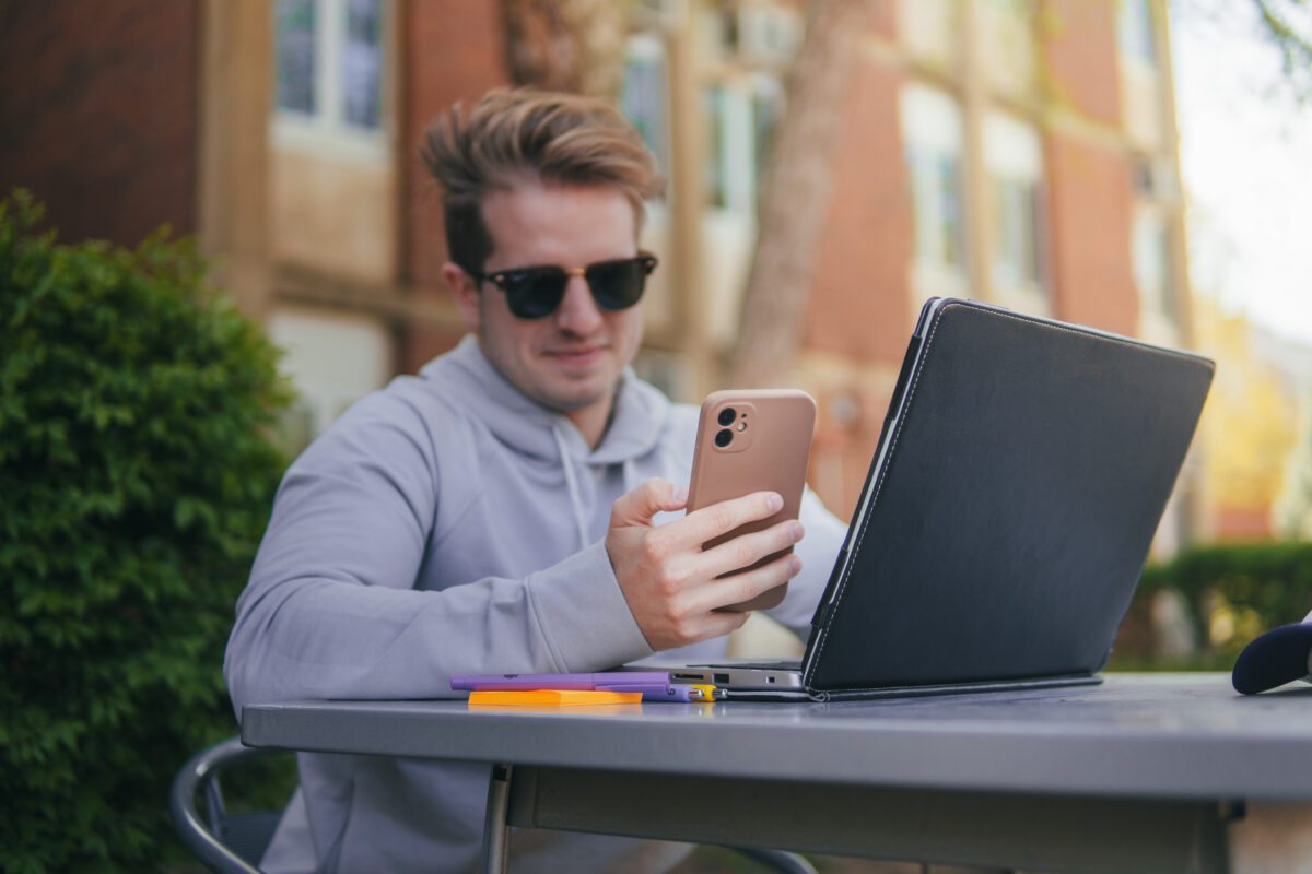 male student on his phone