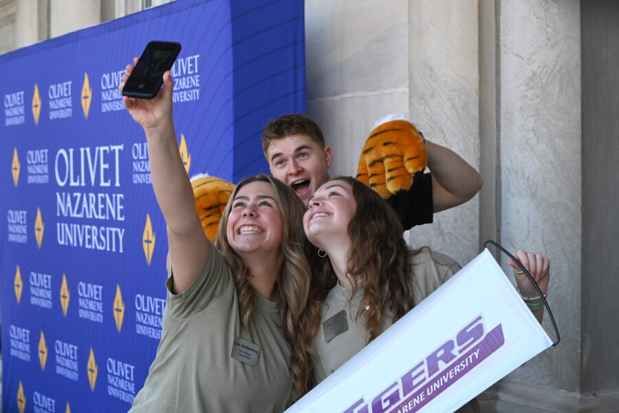 selfie in front of step and repeat