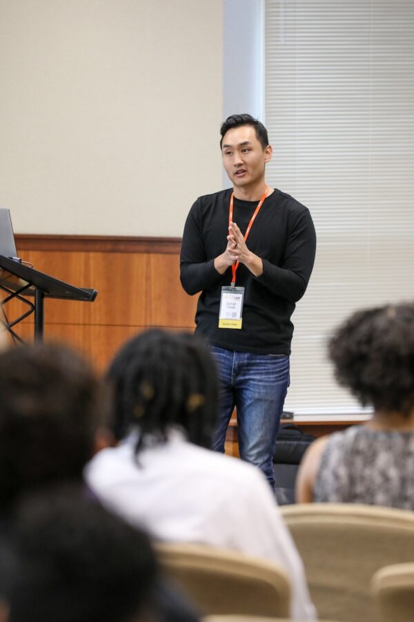 male speaker presenting to a class