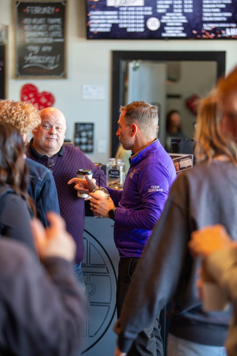 group of people drinking coffee and talking