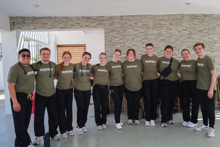 group of students wearing green shirts