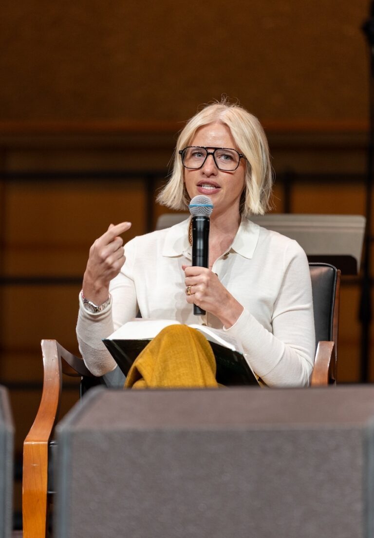 Meyers speaking on stage