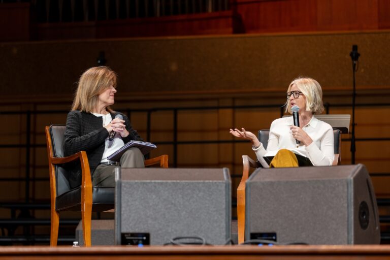 Tammy & Raechel on stage speaking