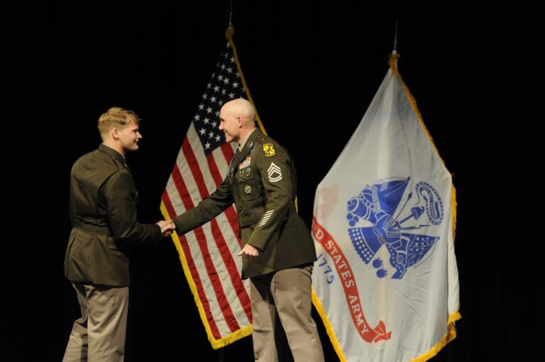 Cameron Benesh shaking hands