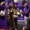 ONU Head Coach Avante Mitchell talks with football players in the locker room. Coach Mitchell was selected by the Black College Football Hall of Fame for the Ozzie Newsome GM Forum and Quarterback Coaching Summit