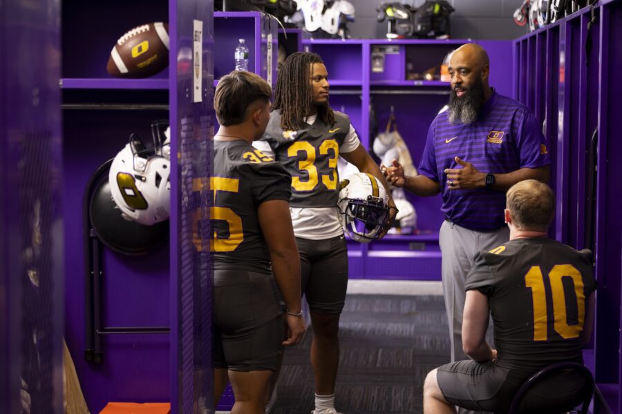 ONU Head Coach Avante Mitchell talks with football players in the locker room. Coach Mitchell was selected by the Black College Football Hall of Fame for the Ozzie Newsome GM Forum and Quarterback Coaching Summit