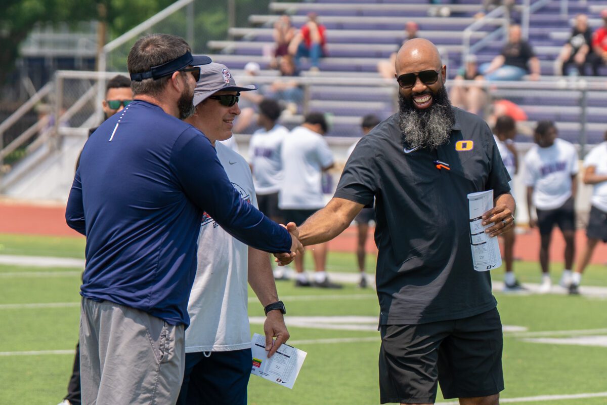 High school football players gather with coaches at the Avante Mitchell Mega Camp hosted by Olivet Nazarene University