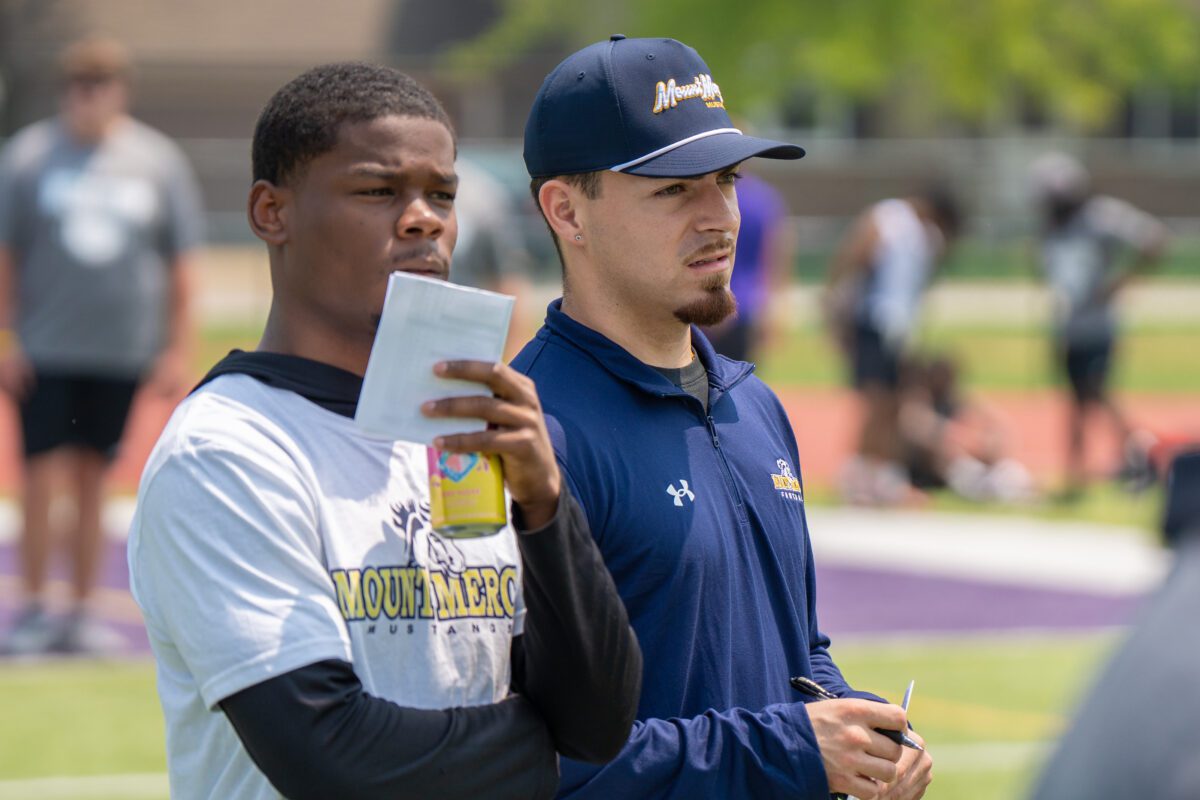Coaches from Mount Mercy University observe high school athletes during the 2025 Avante Mitchell Football Mega Camp at Olivet Nazarene University

