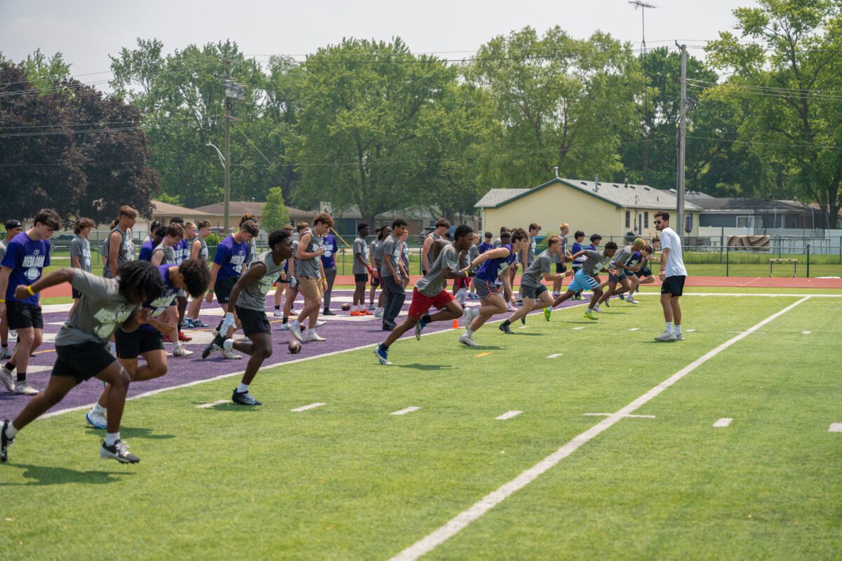 High school athletes launch into sprint drills under coach supervision at the 2025 Avante Mitchell Football Mega Camp at Olivet Nazarene University
