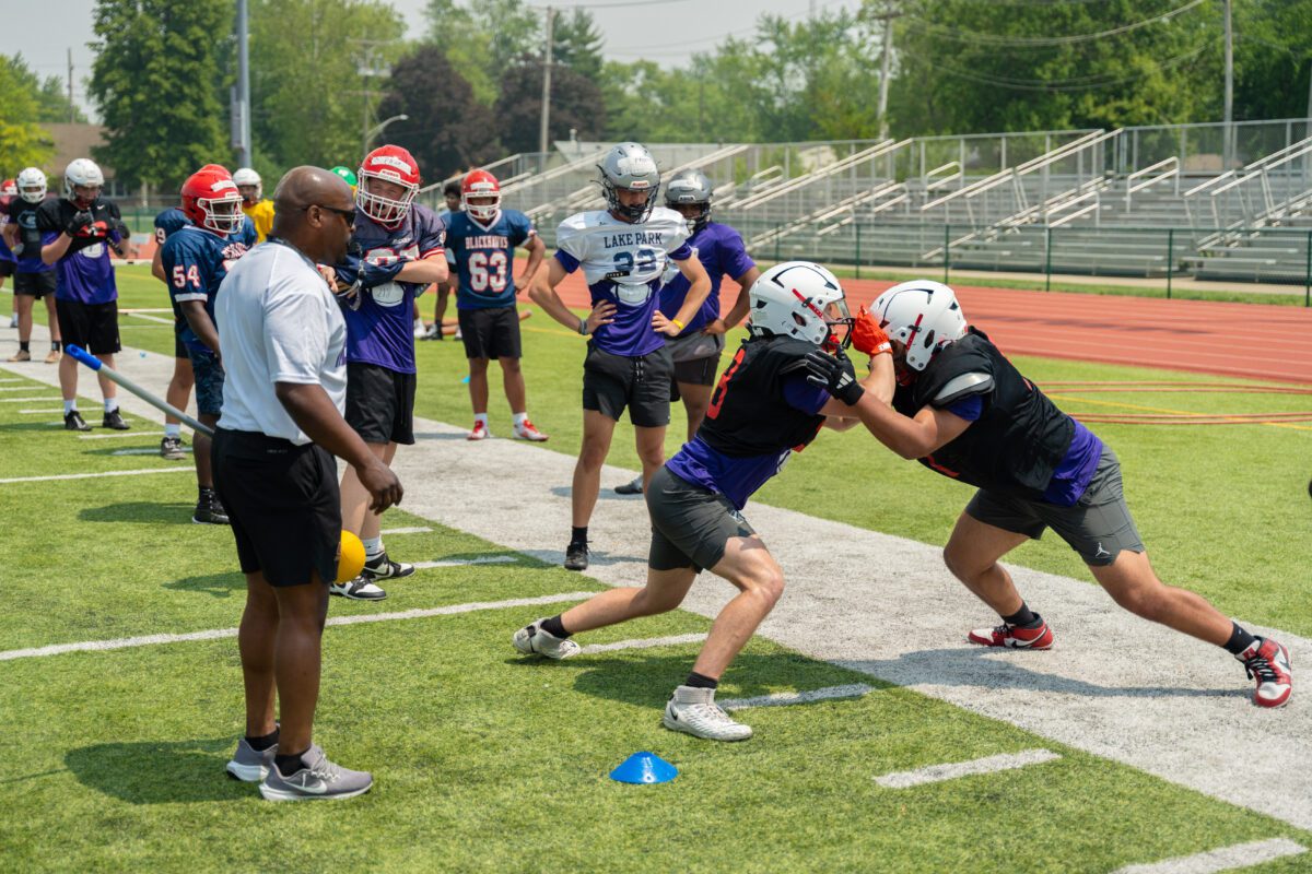 High school linemen compete in blocking drills as coaches and teammates observe during the 2025 Avante Mitchell Football Mega Camp at Olivet Nazarene University


