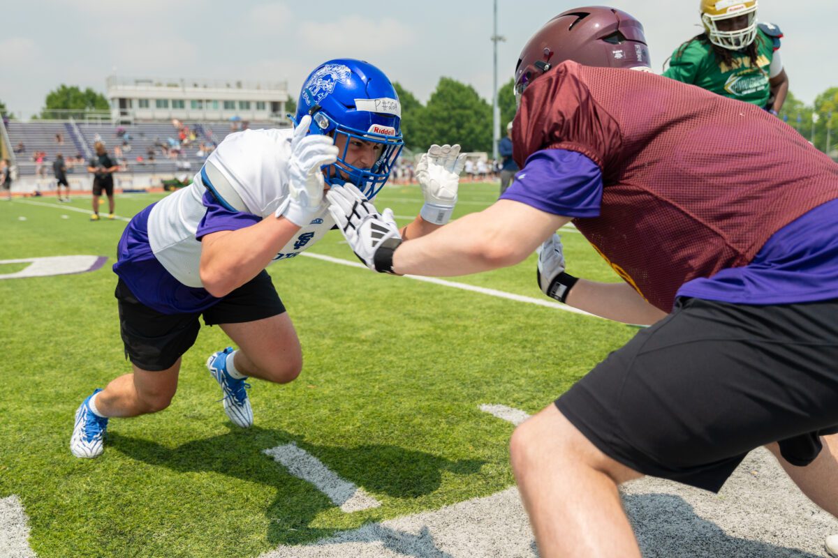 Two high school football players engage in a one-on-one lineman drill at the 2025 Avante Mitchell Football Mega Camp at Olivet Nazarene University

