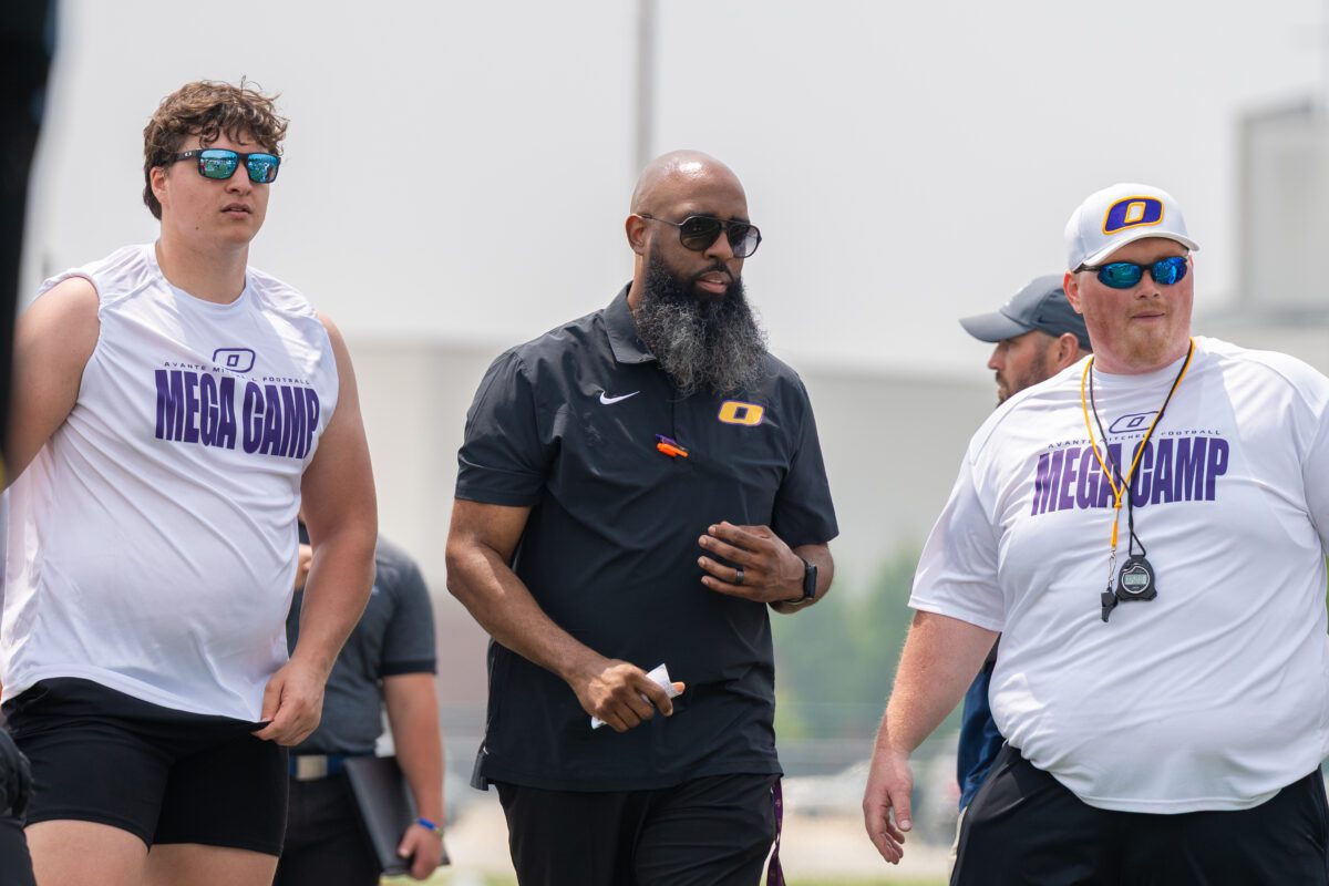 Coach Avante Mitchell talks with athletes during the 2025 Football Mega Camp at Olivet Nazarene University
