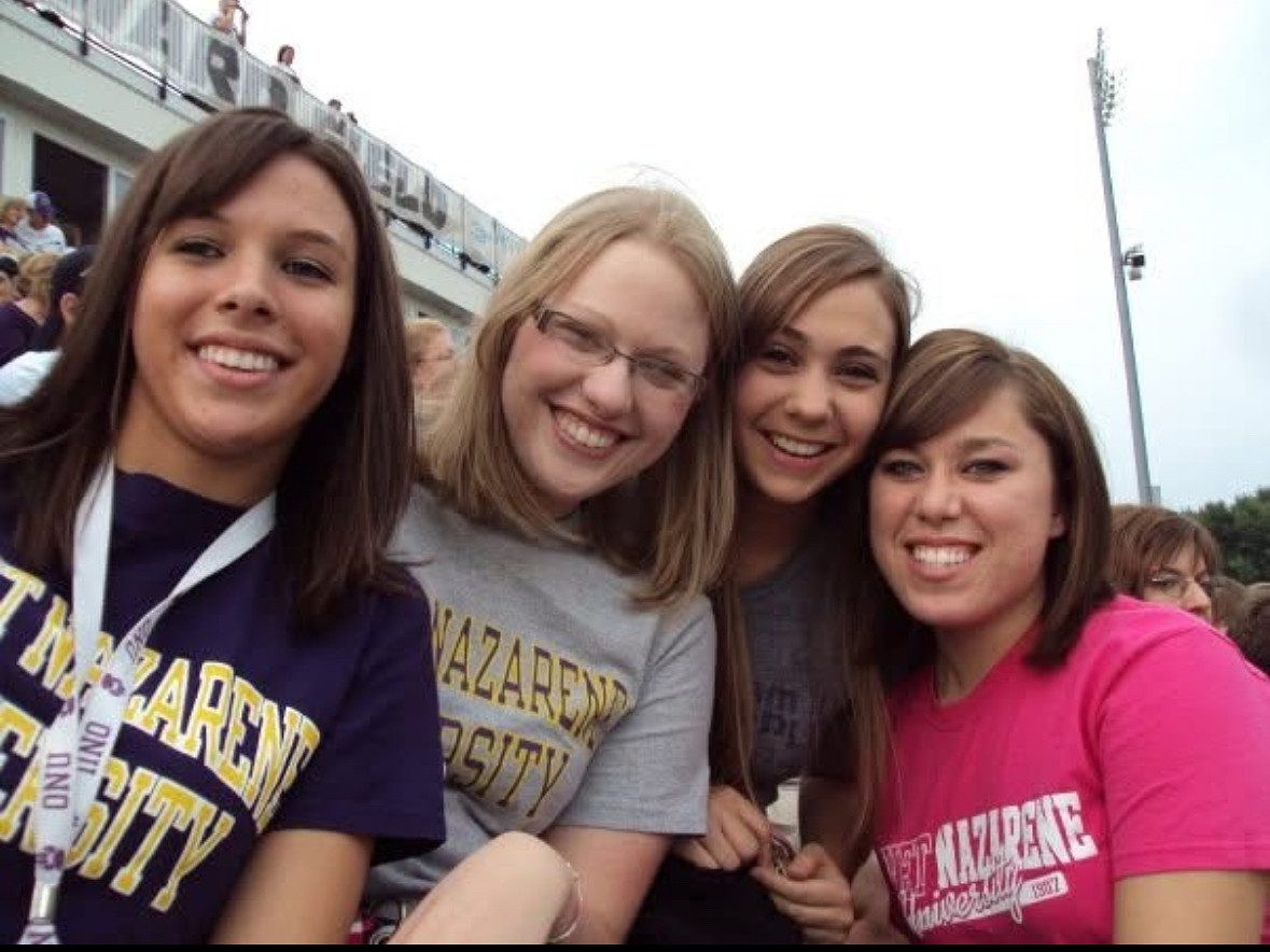 Four girls at a football game