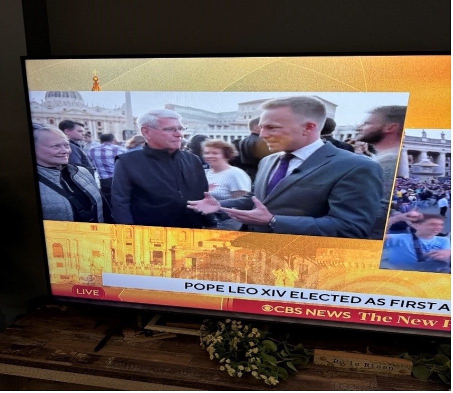 Reporter interviewing a man at the Conclave