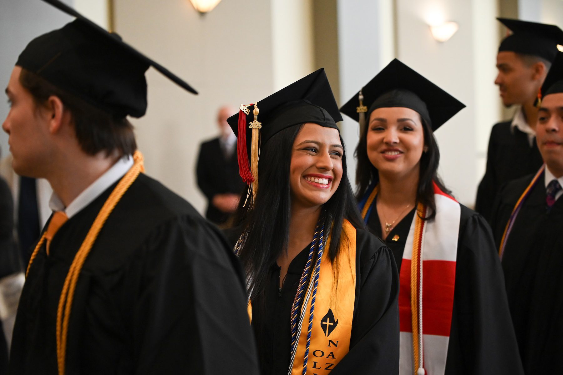 female smiling before graduation ceremony