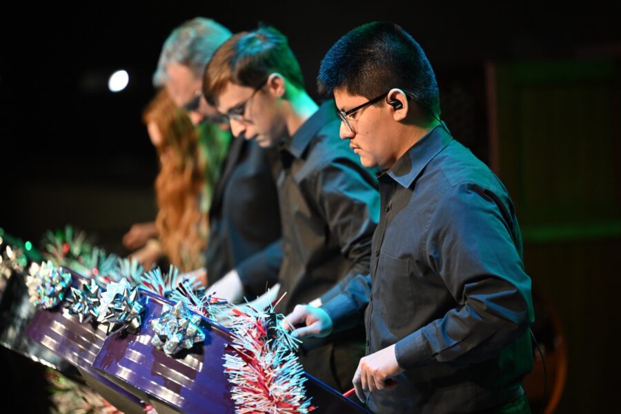 male playing steel drums