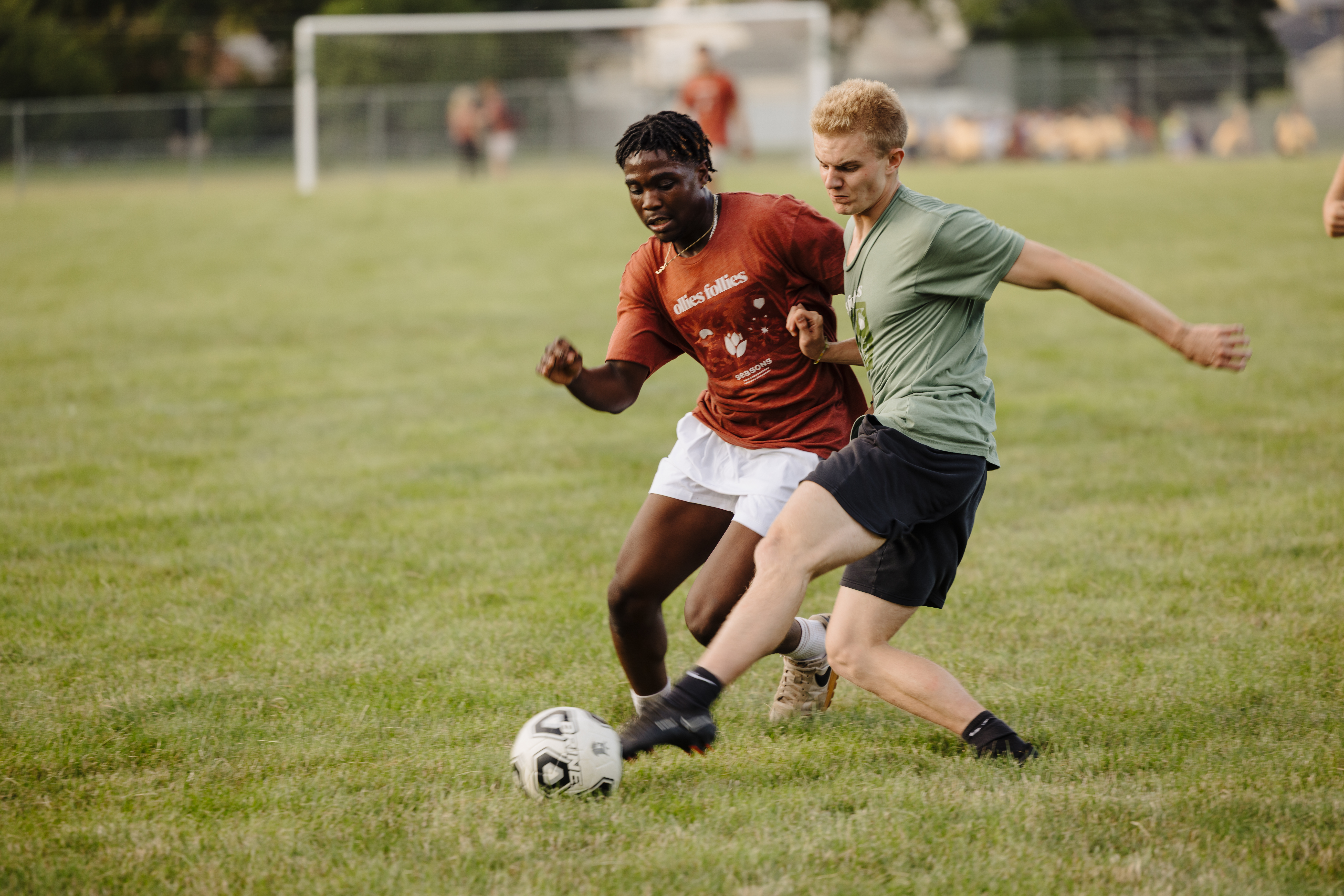 Two guys playing soccer