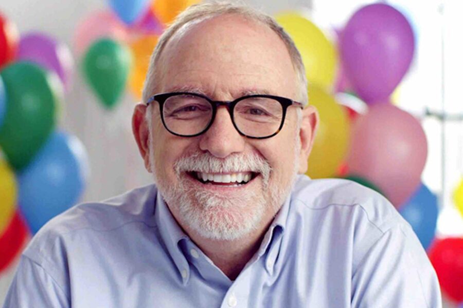 Bob Goff with balloons behind him