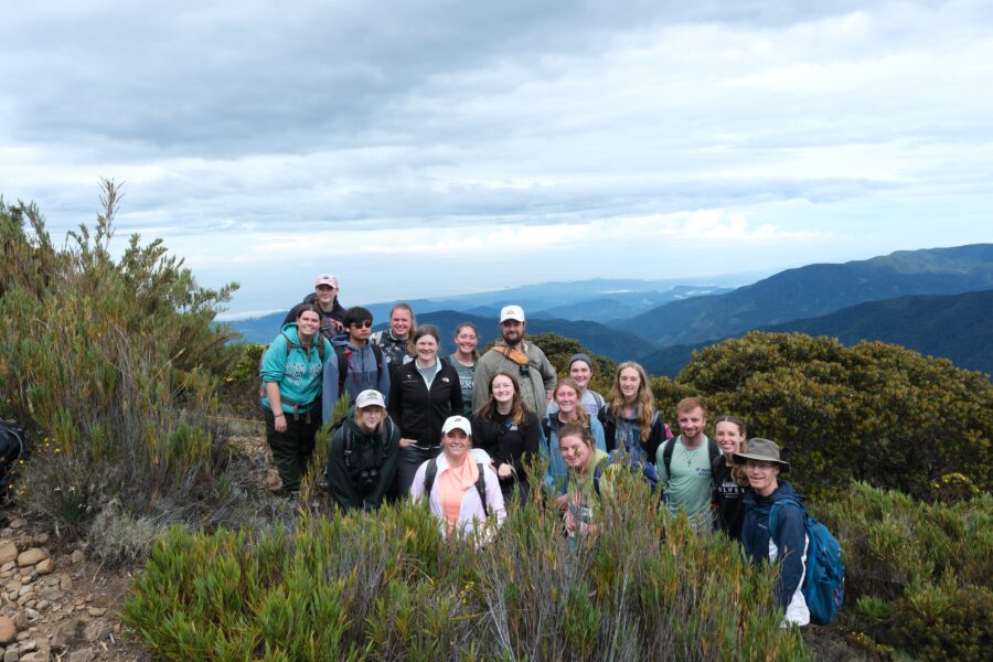 Group of people standing on a mountain