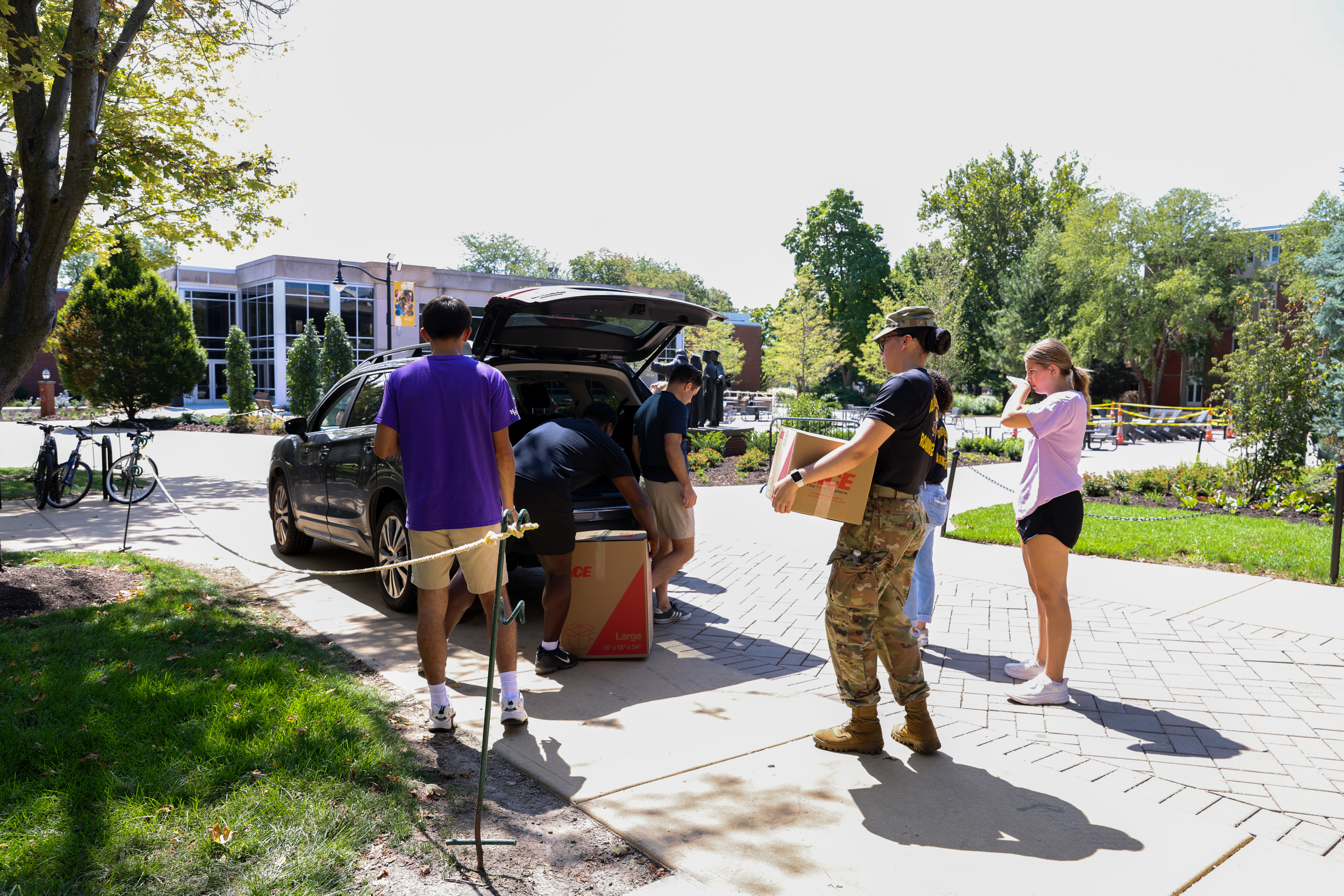 People helping new student move-in