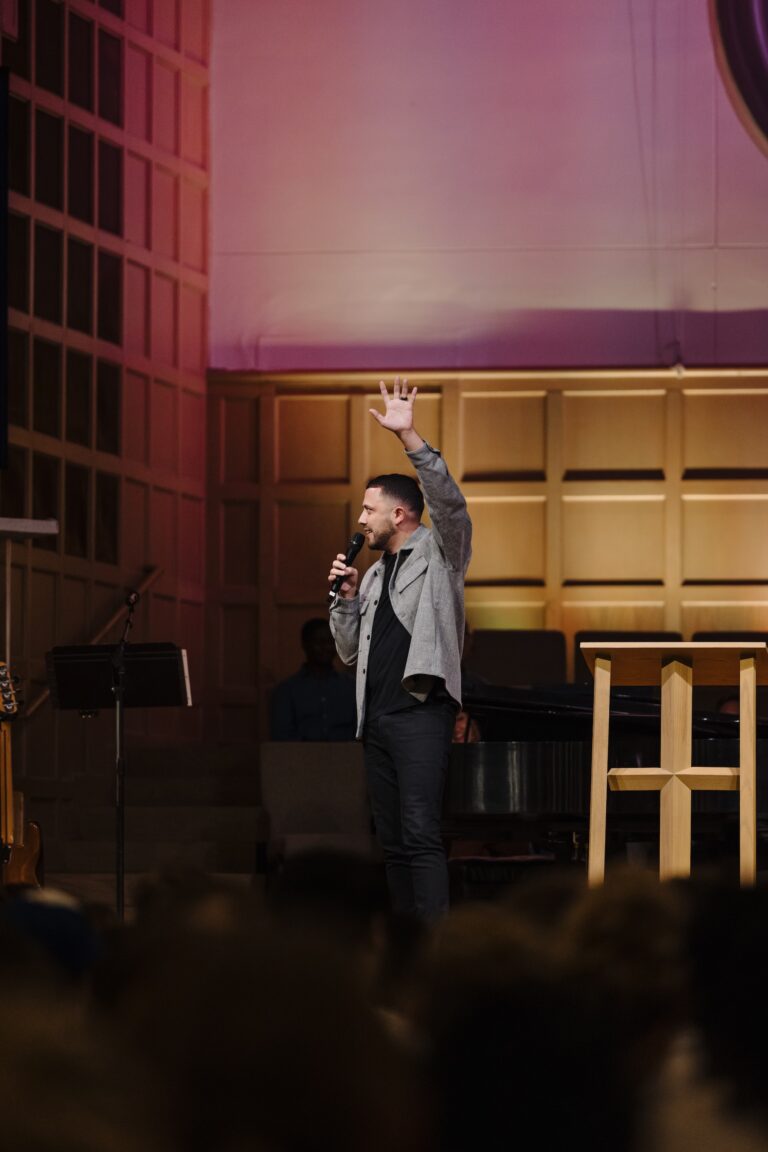 shane lima raising arm in praise