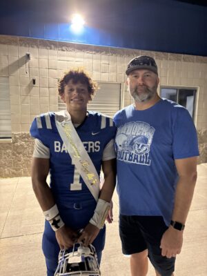 Dennis with his son after a football game