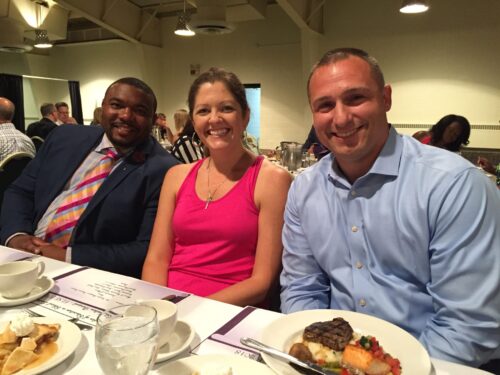 Will Akin with classmates at a dinner