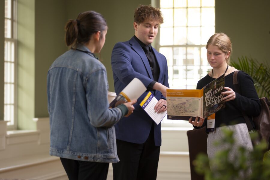 Admissions counselor speaking with students