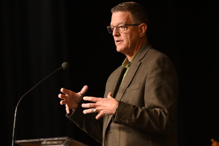 Rev. Mark Holcomb speaking