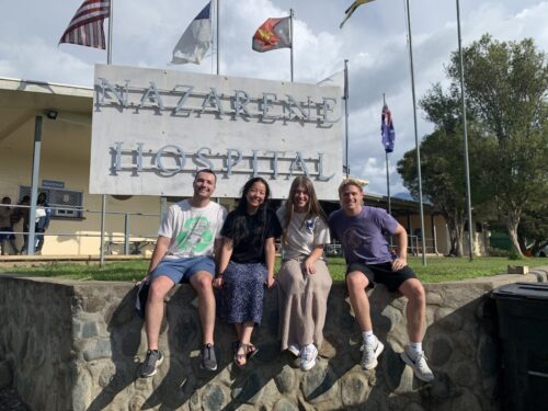 Two guys and two girls in front of the Nazarene hospital in Papua New Guinea