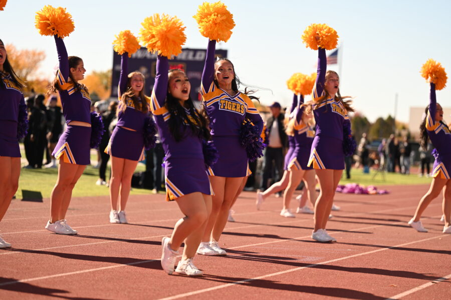 Cheerleaders at the football game cheering