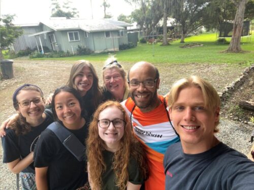 Group of people in front of a house