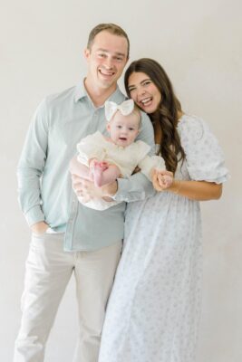 Michaela and Joe Mantarian holding their daughter