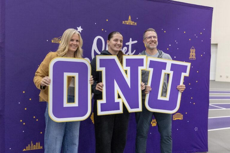 family posing with O N U letters