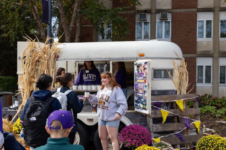 students passing out food