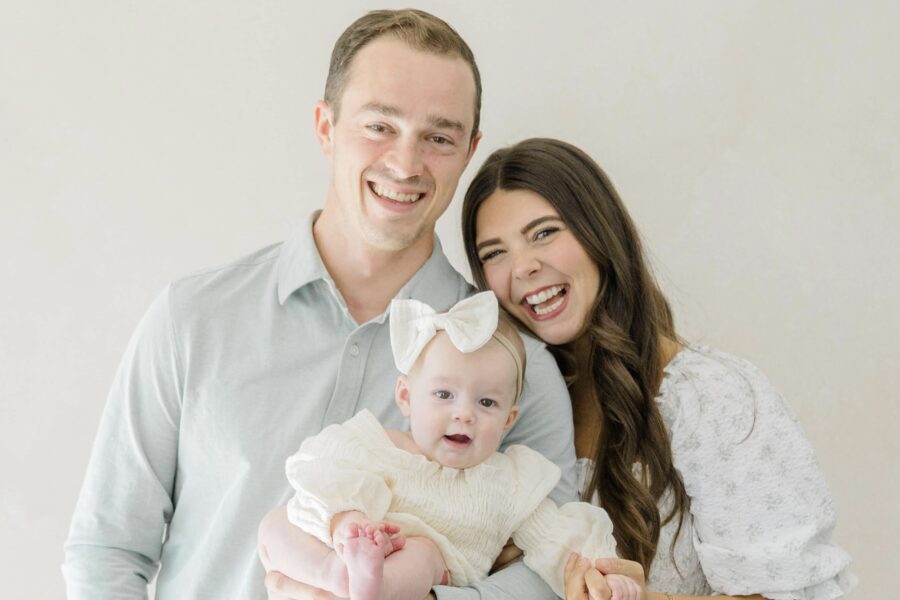 Michaela and Joe Mantarian holding their baby
