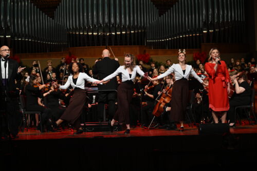 Group of people dancing on stage during the Sounds of the Season