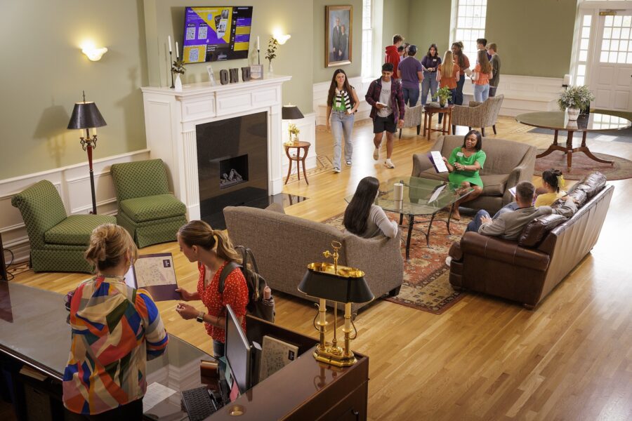 The Olivet Admissions staff telling potential students about the campus life at Olivet in the admissions office on campus.