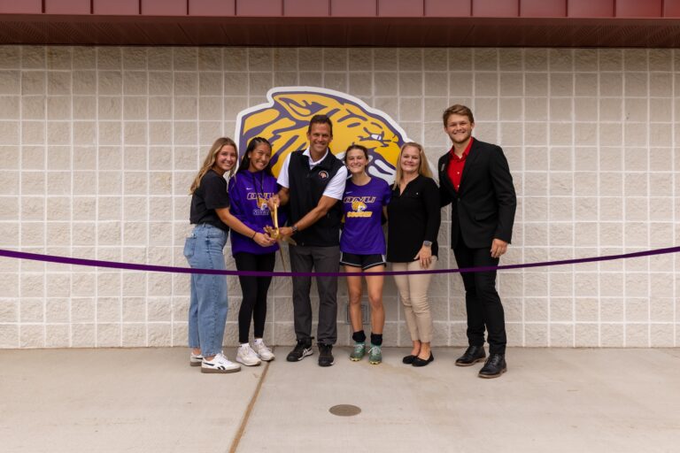 Bahr family cutting a ribbon