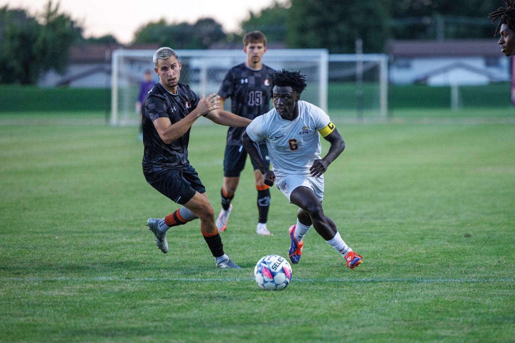 Soccer player in ONU uniform has posession