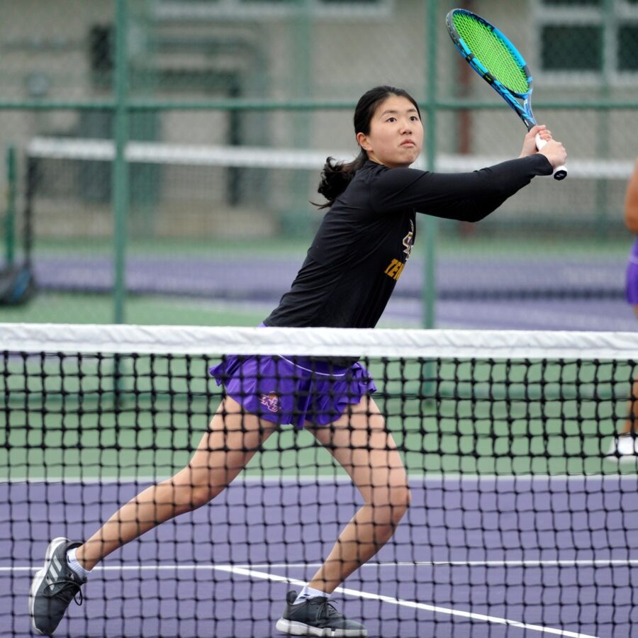 ONU tennis player swings a green racket