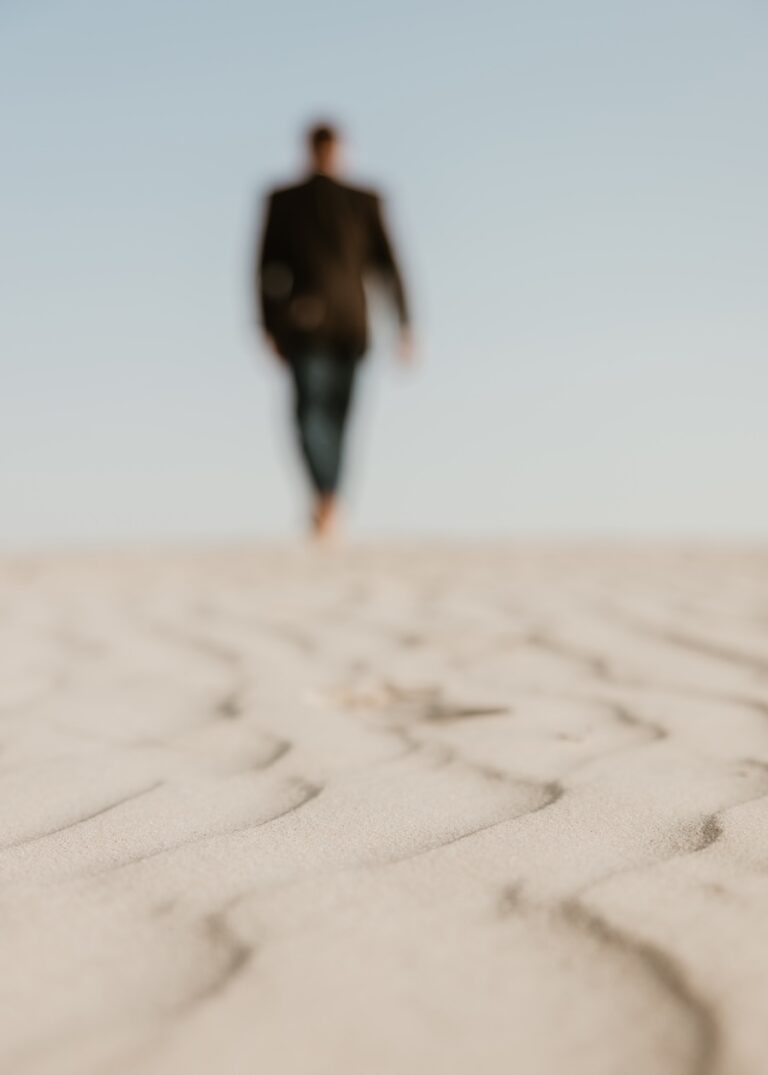 Man walking in sand