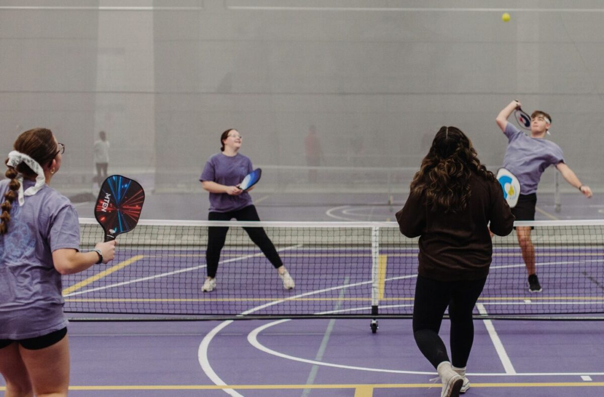 Four students playing pickleball, a new sport at ONU